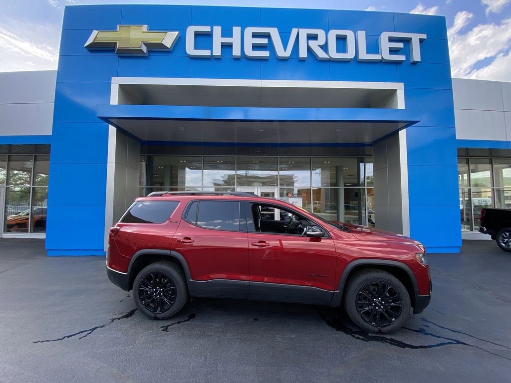 2023 GMC Acadia SLE in Volcanic Red Tintcoat — front three-quarter view